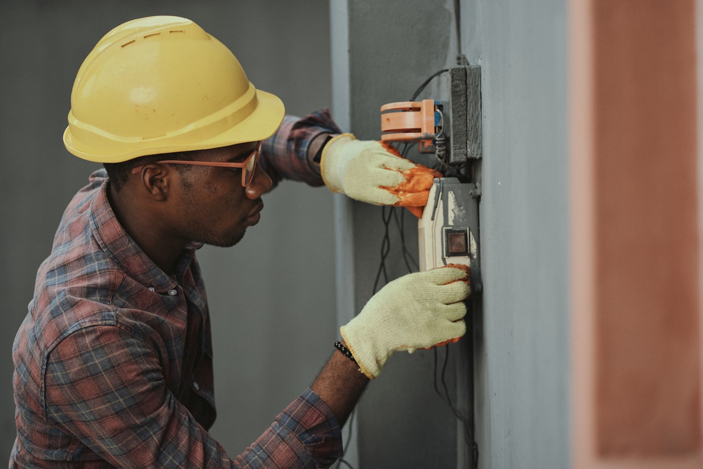 Electrician working on consumer unit