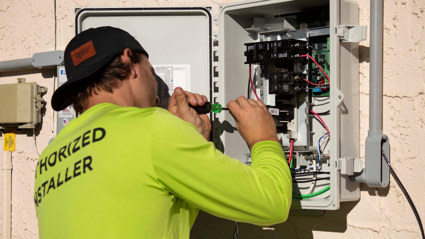 Electrician inspecting wiring